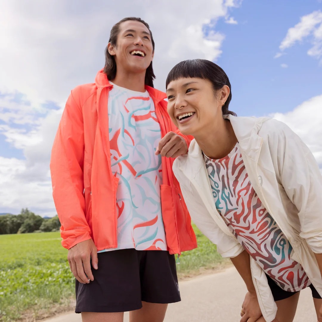 Male and Women standing outside laughing