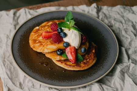 Pancakes with strawberries and blueberries