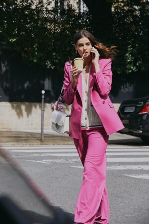 Woman in pink suit from Maje
