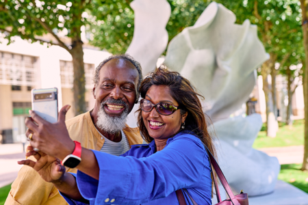 Couple enjoying the art at Canary Wharf