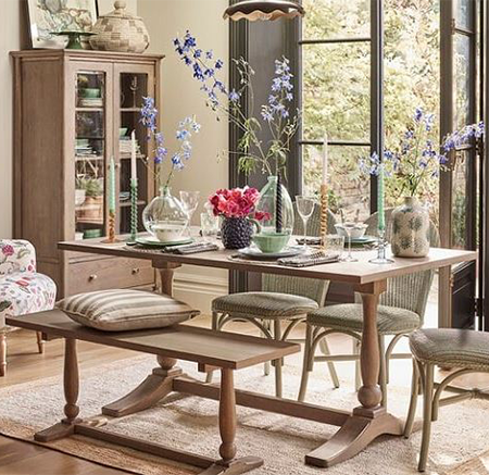 Dining table with fresh flowers in vases