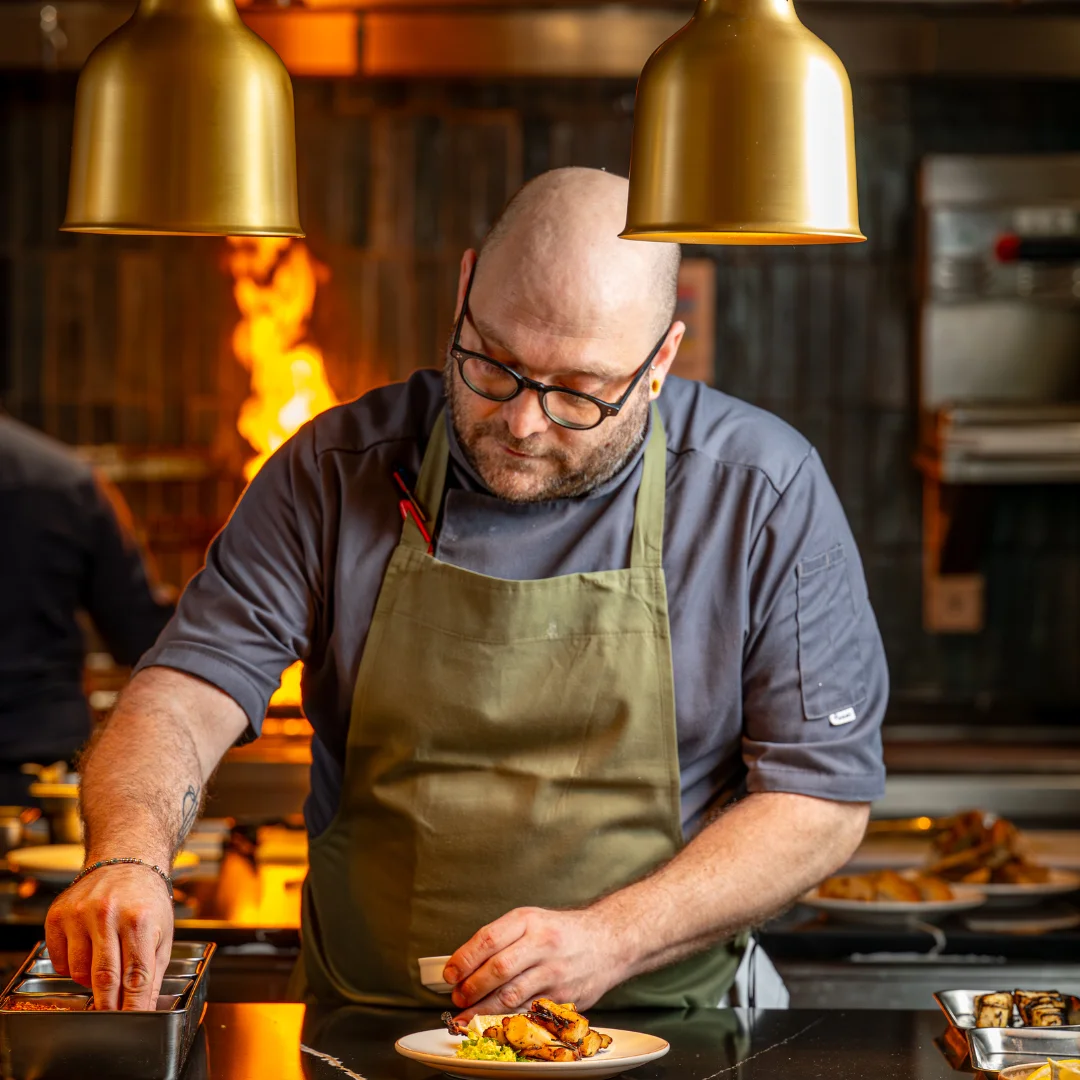 open kitchen in hovard, man cooking food