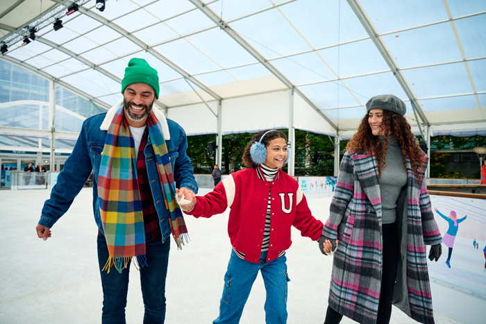 Family skating and having fun on the Ice rink