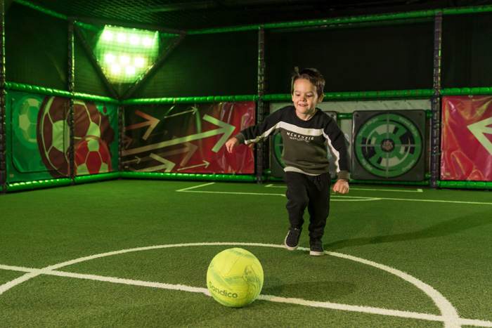 Kid playing with a football