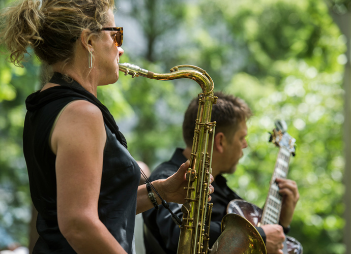 A performer playing the brass