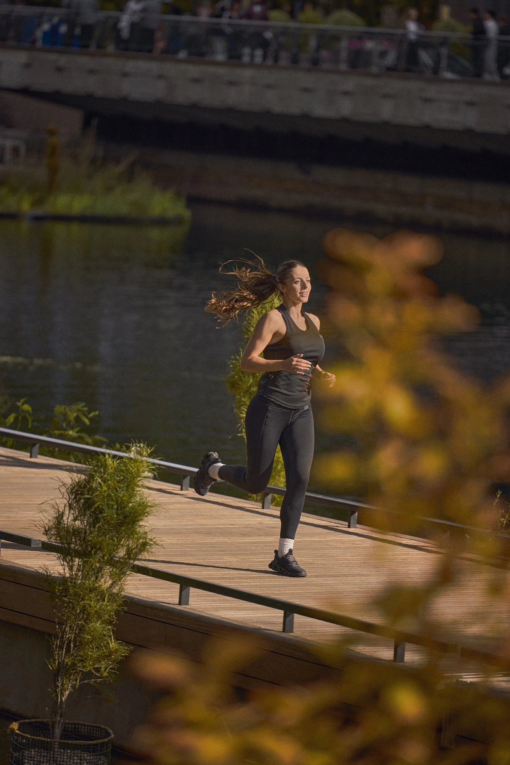 Girl running by water