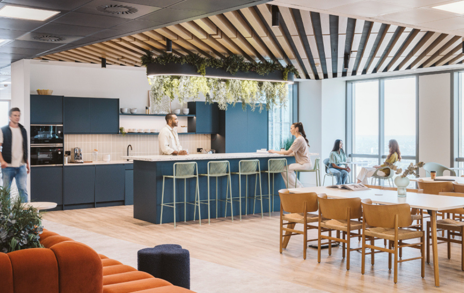 people in communal kitchen in office