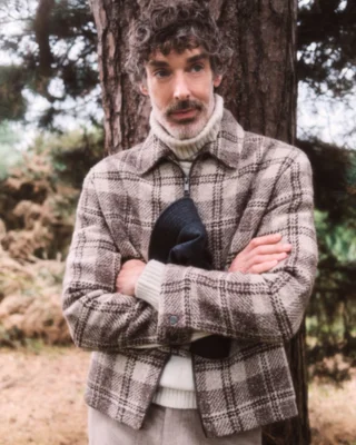 Man folding arms in a jacket