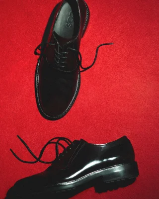 mens shoes on a red background