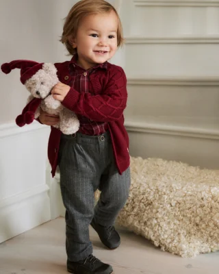 little child holding teddy bear