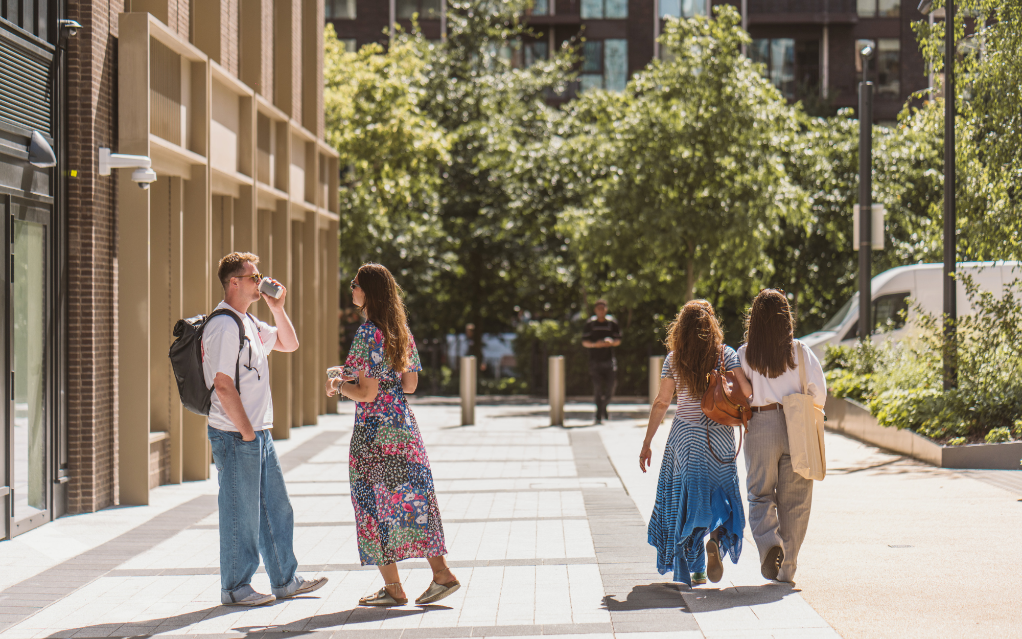 people walking and talking on street