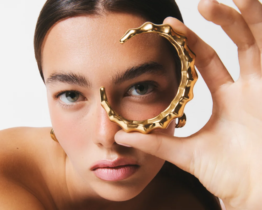 girl holding a cuff bracelet