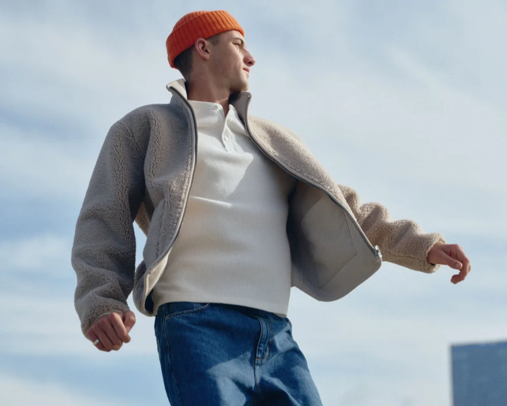 man with orange hat and jacket