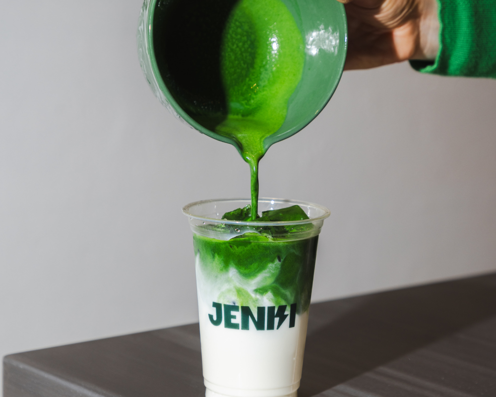 Pouring matcha into milk