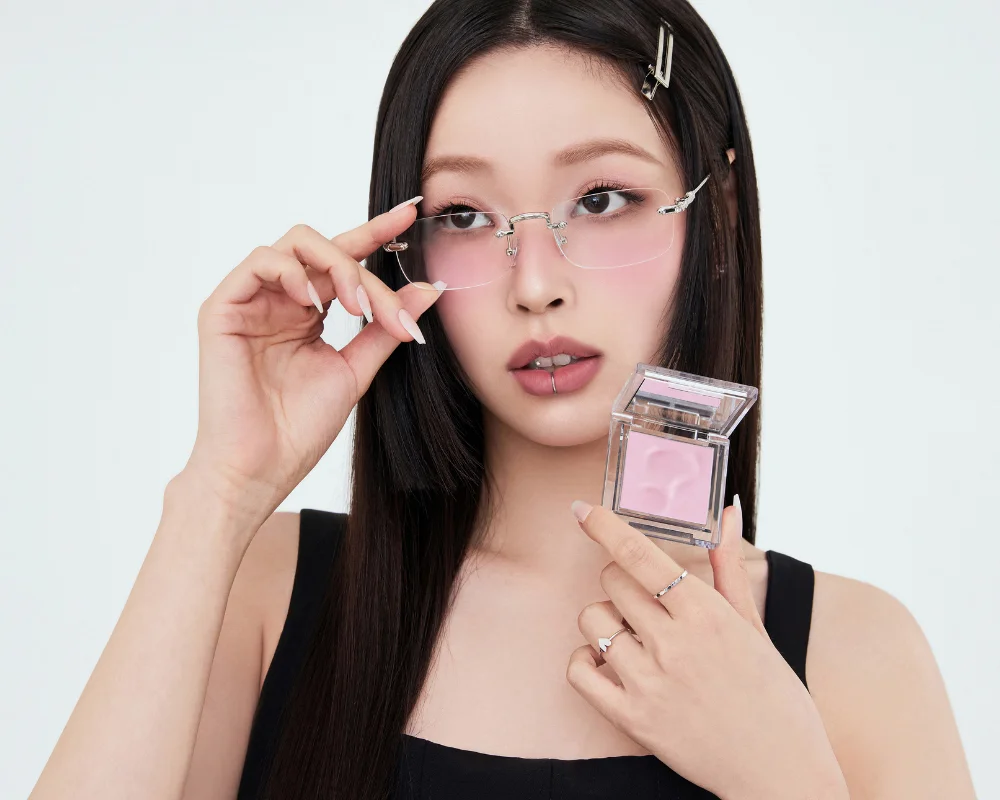 girl holding a pink blush