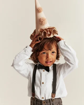 Boy with tuexdo bow tie shirt