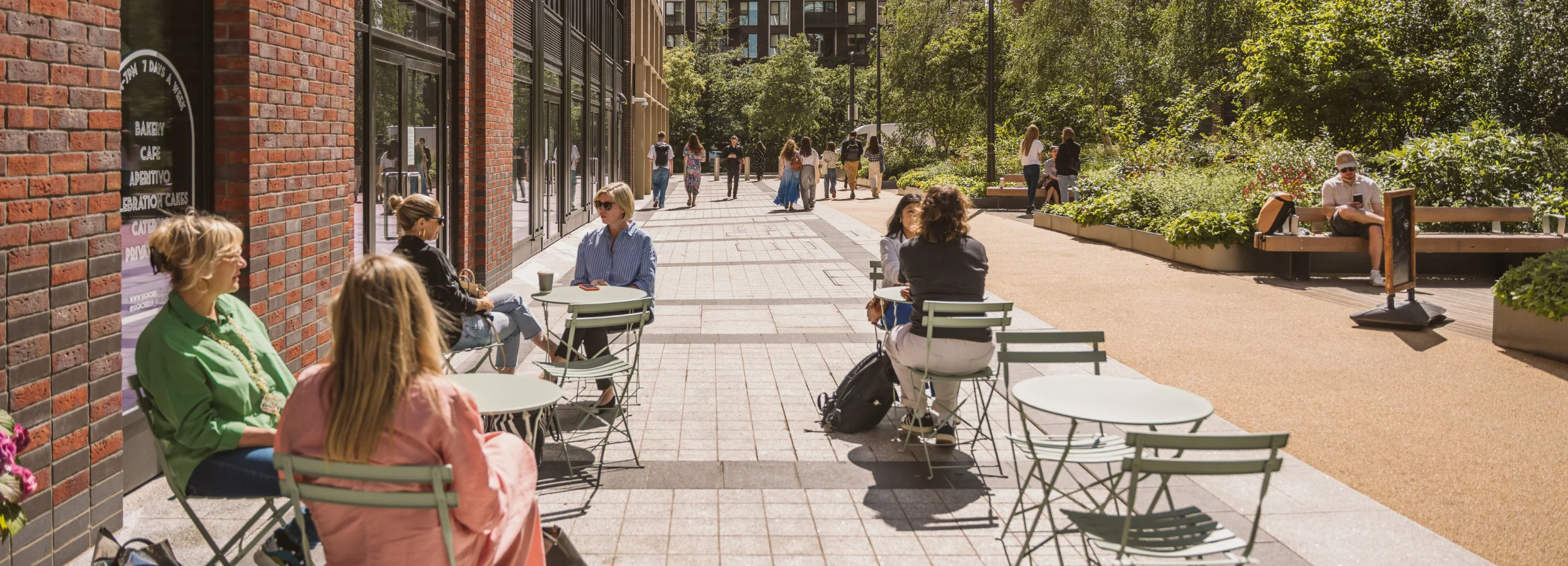 people sitting outside a coffee shop